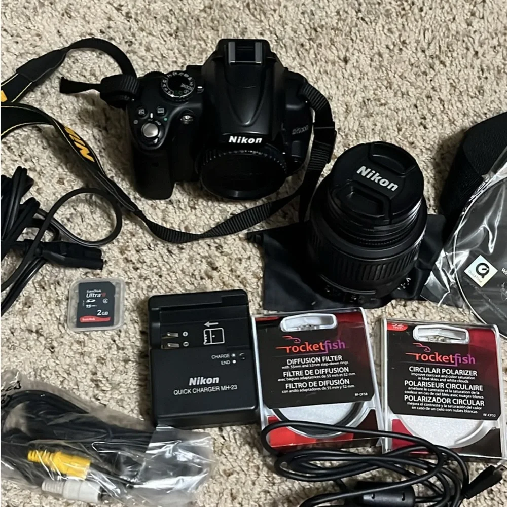 Nikon D5000 DSLR Camera with 18-22 mm lens & 1 battery, bag, and more